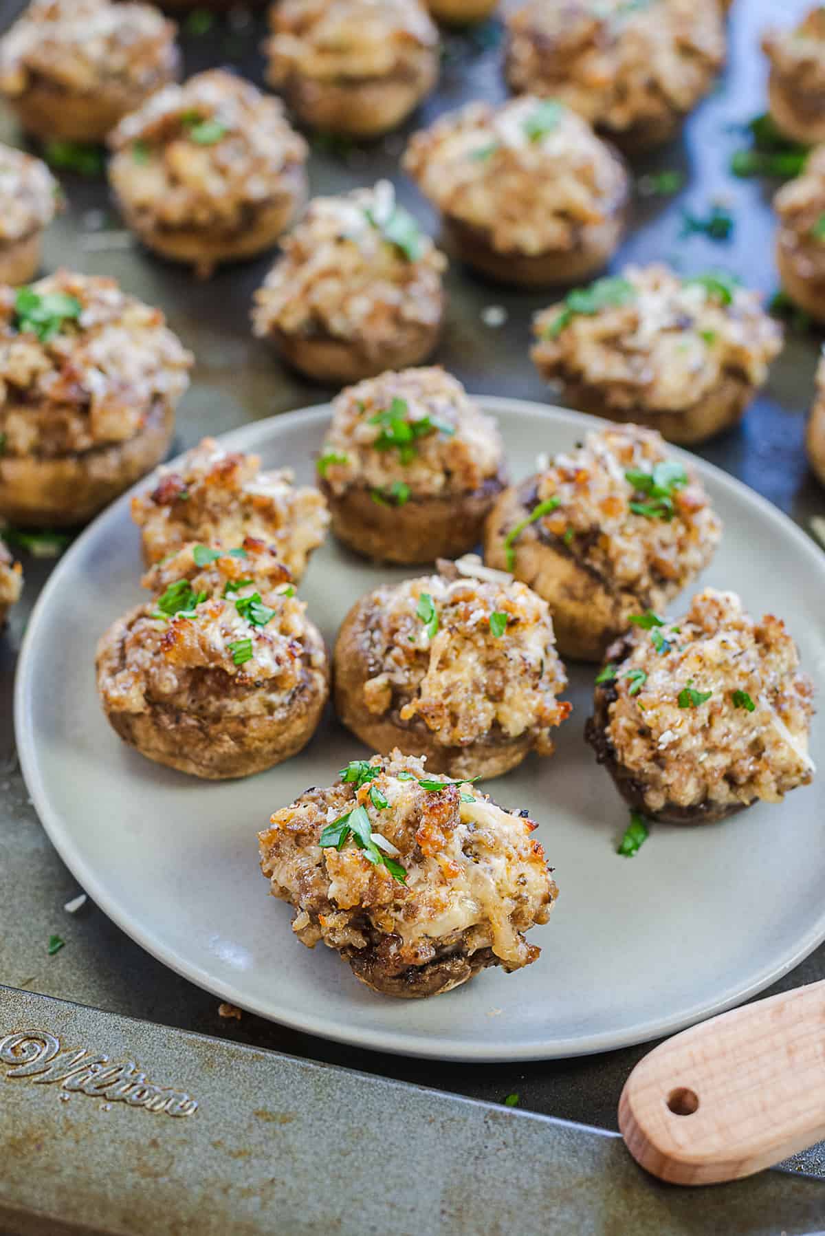 sausage stuffed mushrooms on pan.