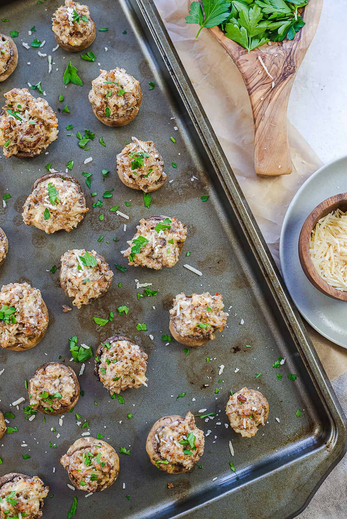 sausage stuffed mushrooms on pan.