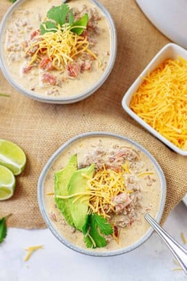 keto taco soup in small bowls with cheese.
