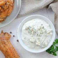 blue cheese dressing in small white bowl.