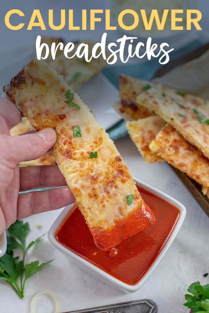 breadstick dunked in marianra with text for PInterest.