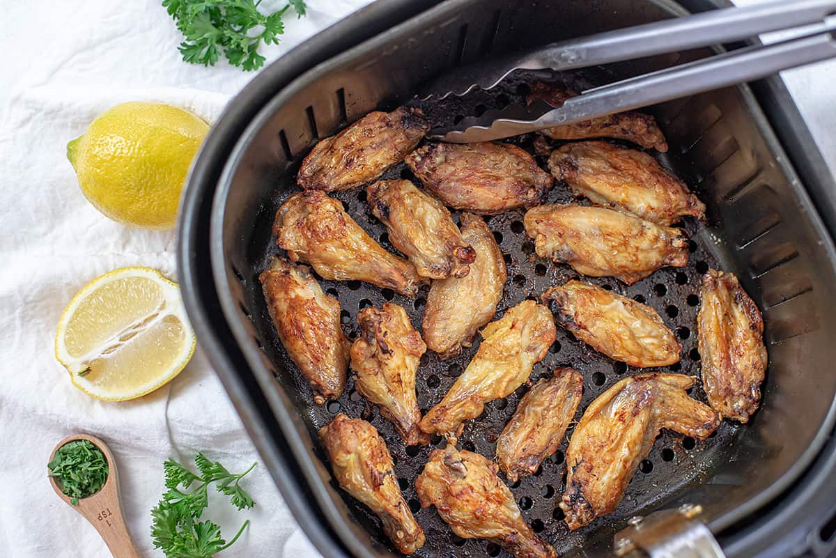 wings in air fryer basket.