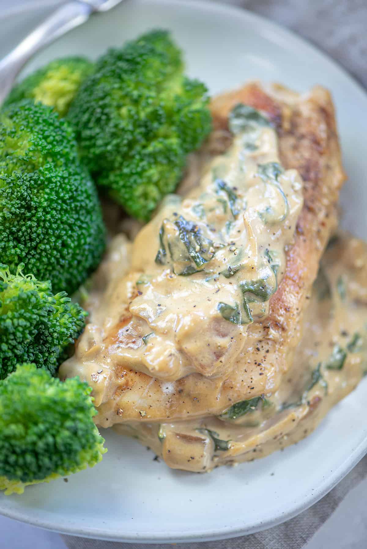 dijon chicken on plate with broccoli.