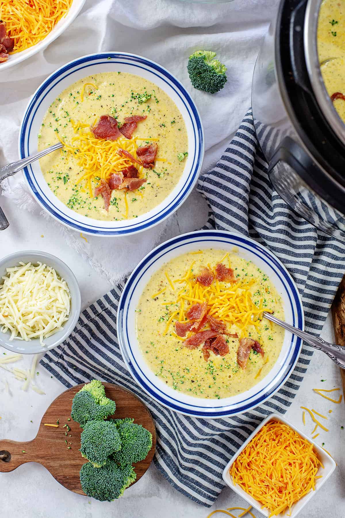 cheesy broccoli soup in bowls.