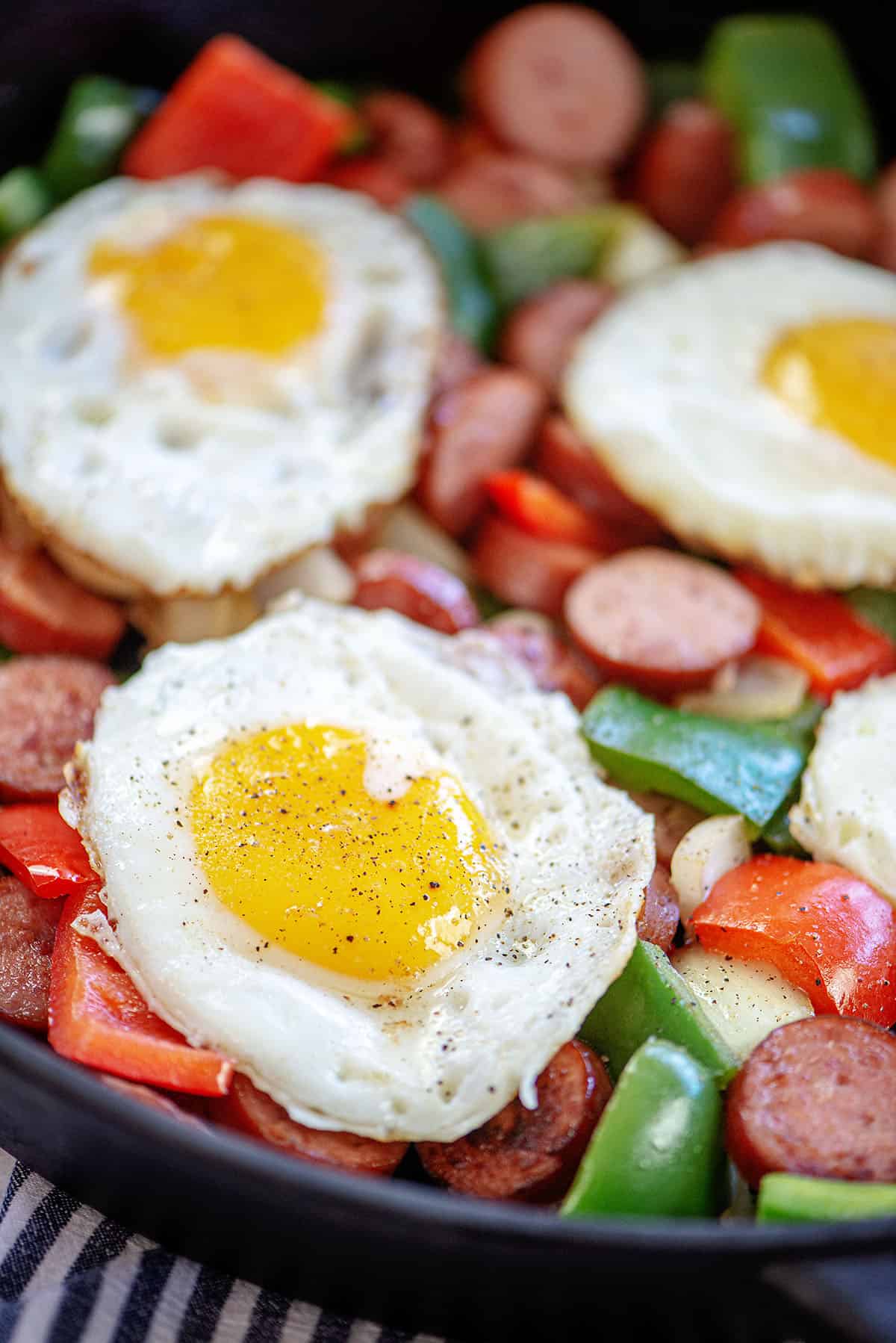 fried eggs over breakfast hash.