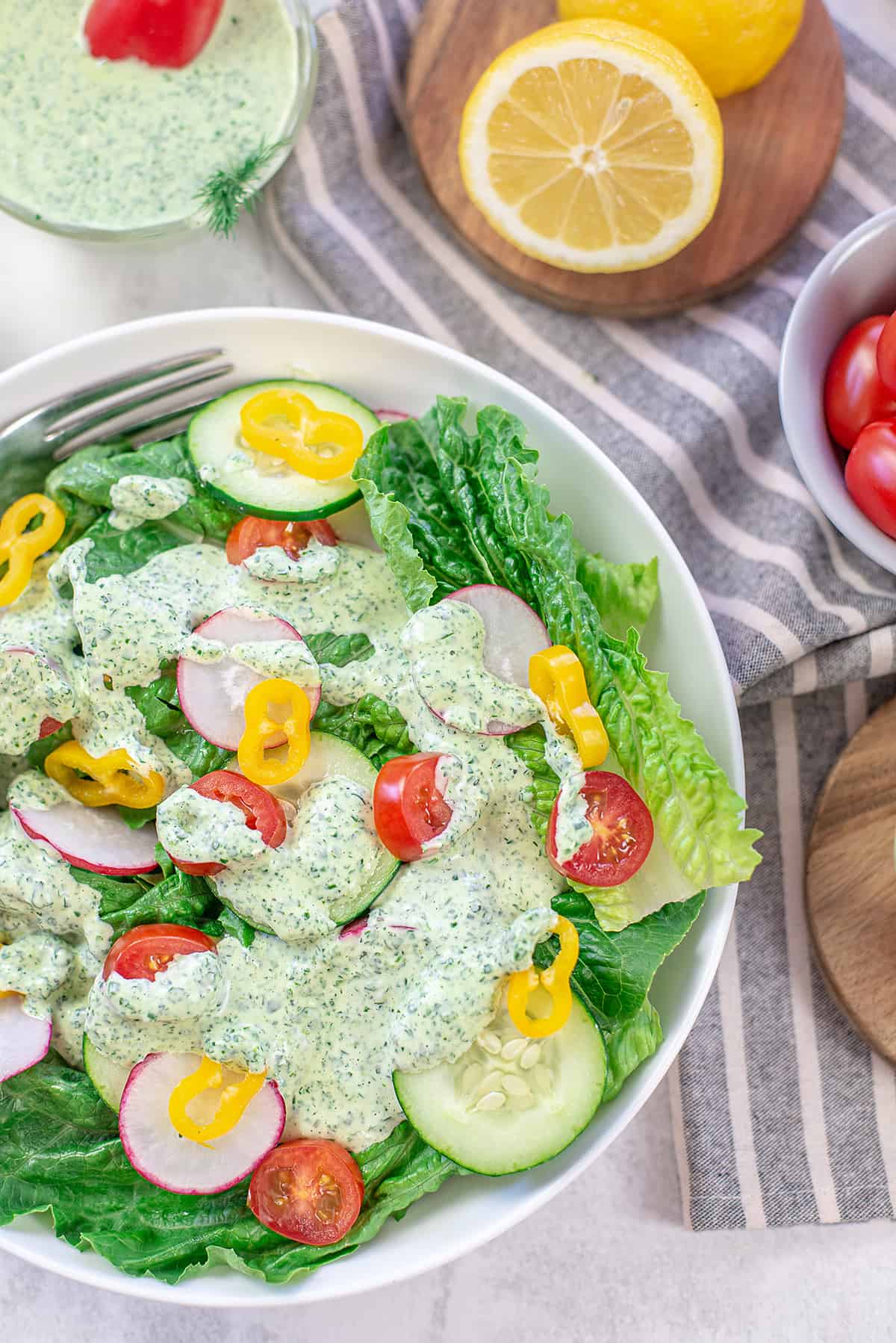 salad topped with green goddess dressing.