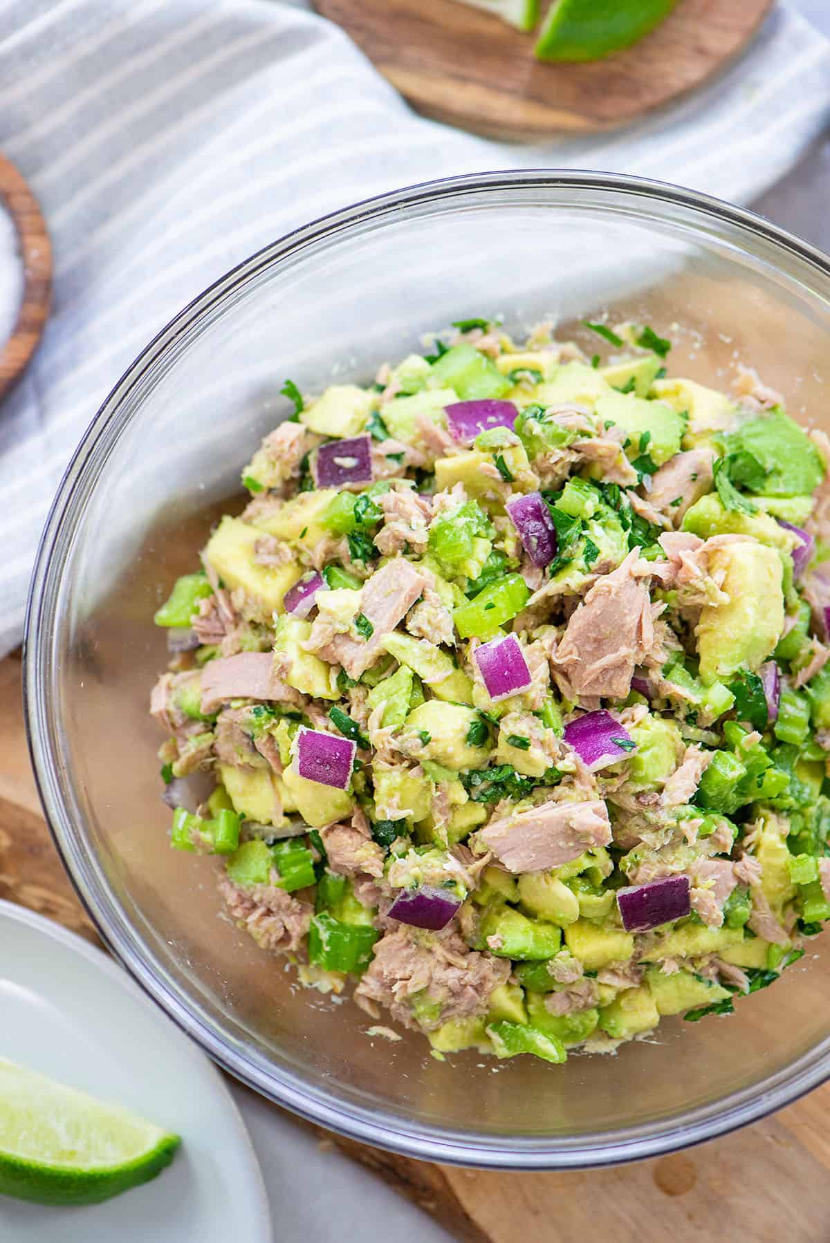 avocado tuna salad in glass bowl.