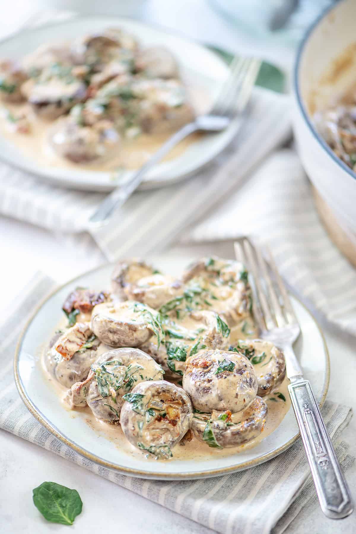 Tuscan mushrooms on white plate.