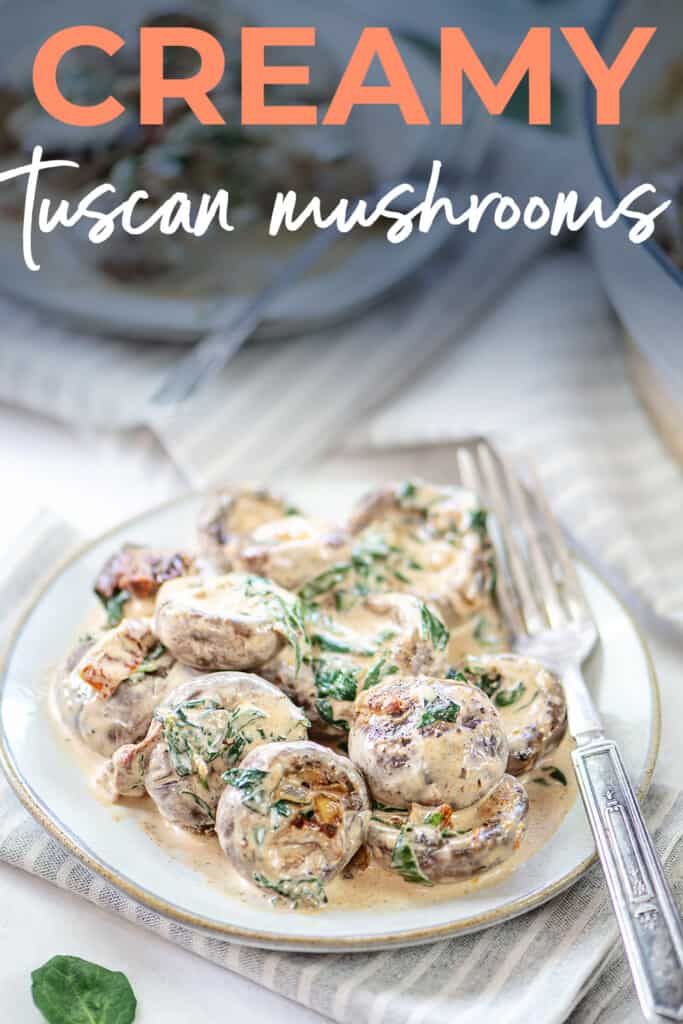 Tuscan mushrooms in cream sauce on white plate.