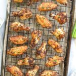 dry rub chicken wings on baking sheet.