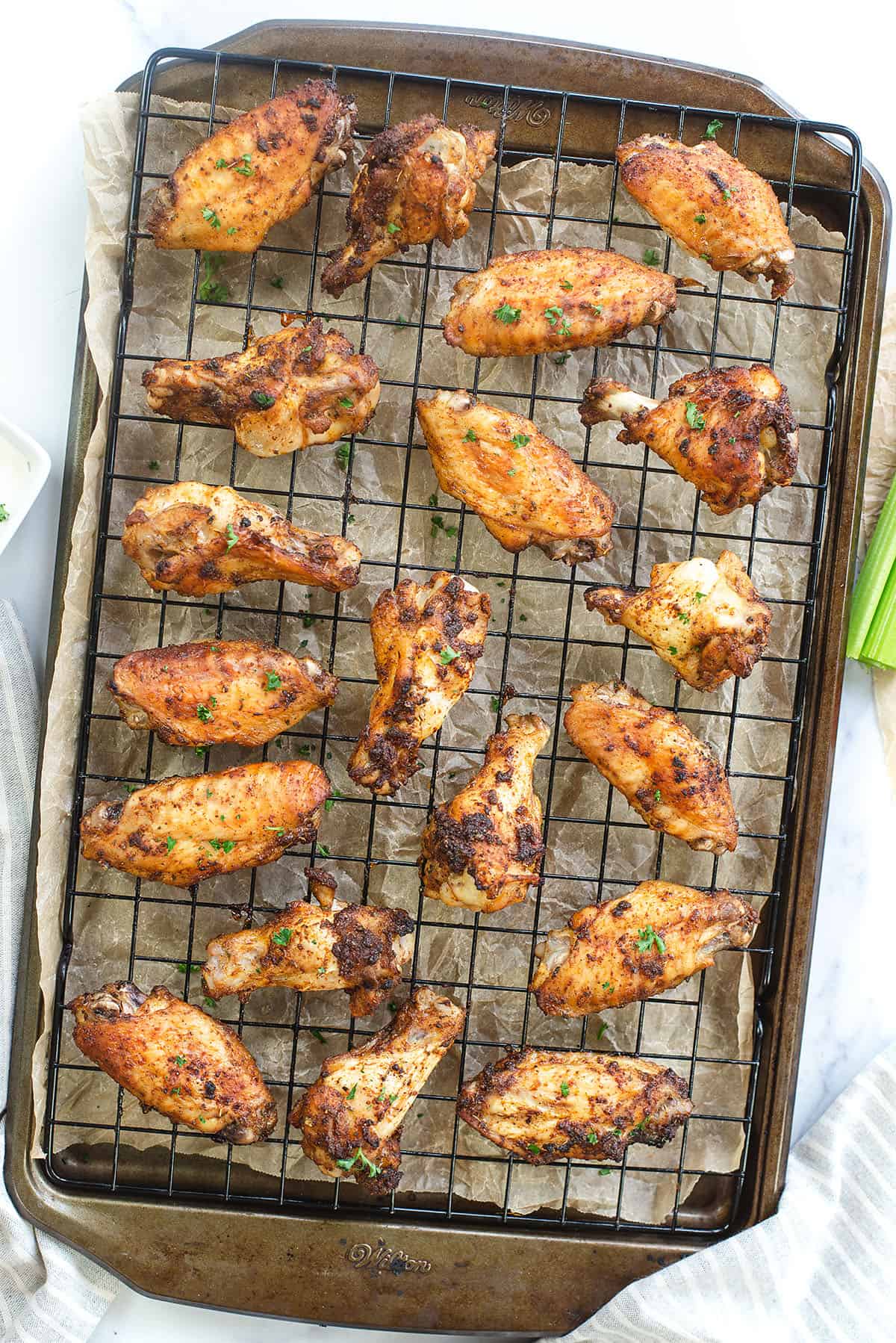 dry rub chicken wings on baking sheet.