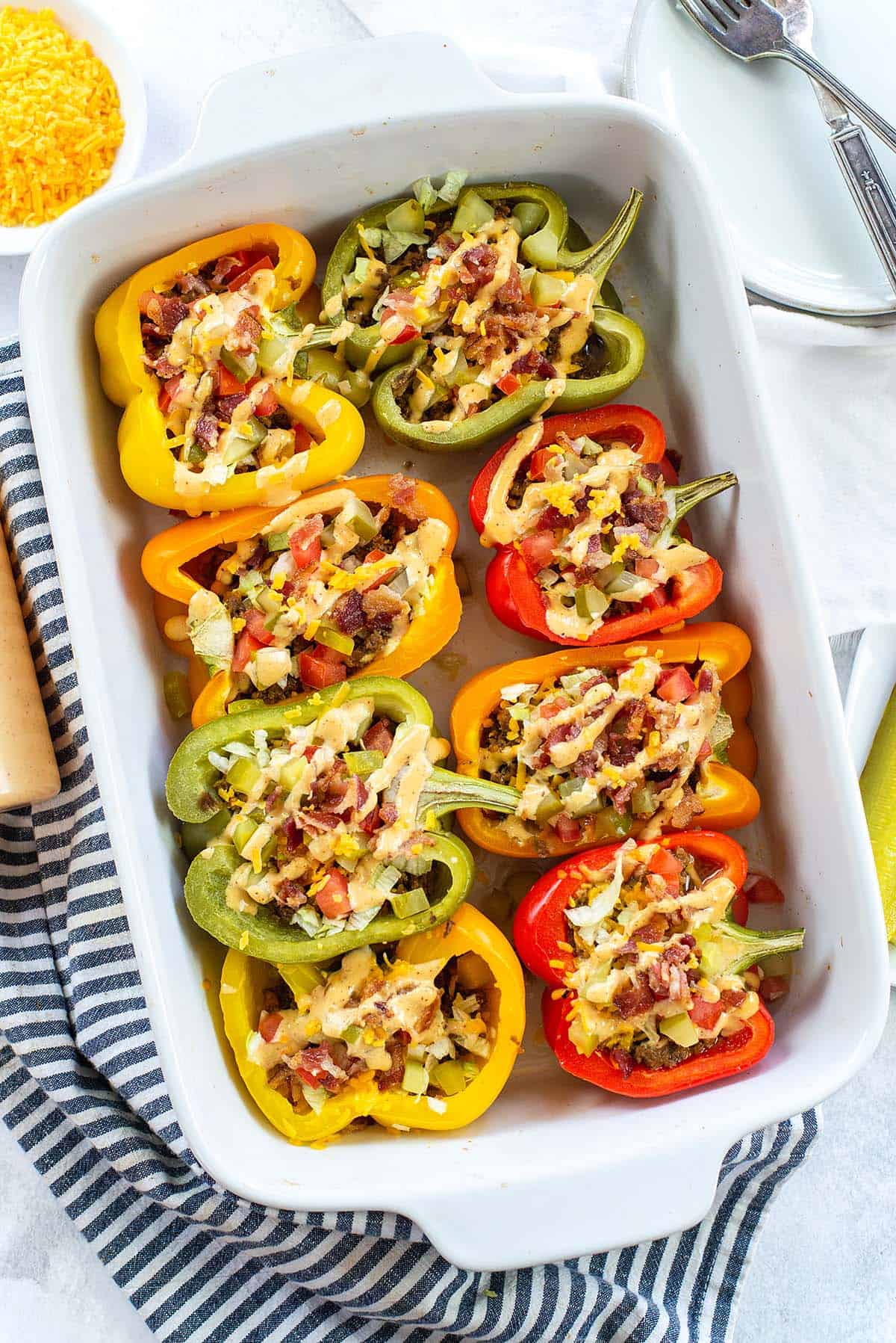 cheeseburger stuffed peppers in baking dish.