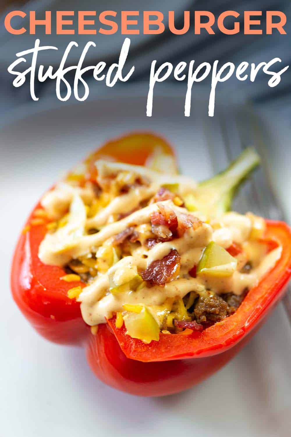 stuffed pepper on white plate with text for PInterest.