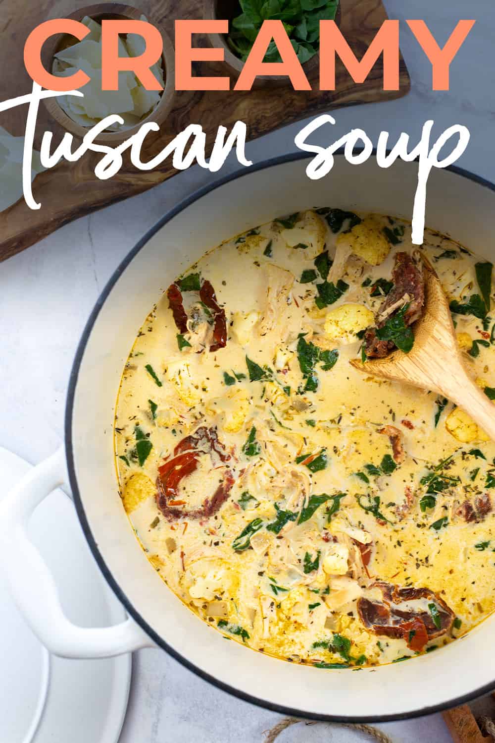 Tuscan soup in white dutch oven with text for Pinterest.