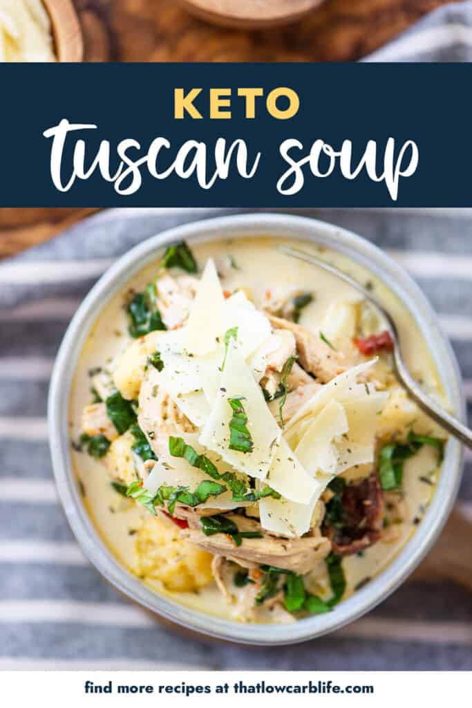 bowl of tuscan chicken soup with parmesan and basil on top.