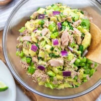 avocado tuna salad in glass bowl.