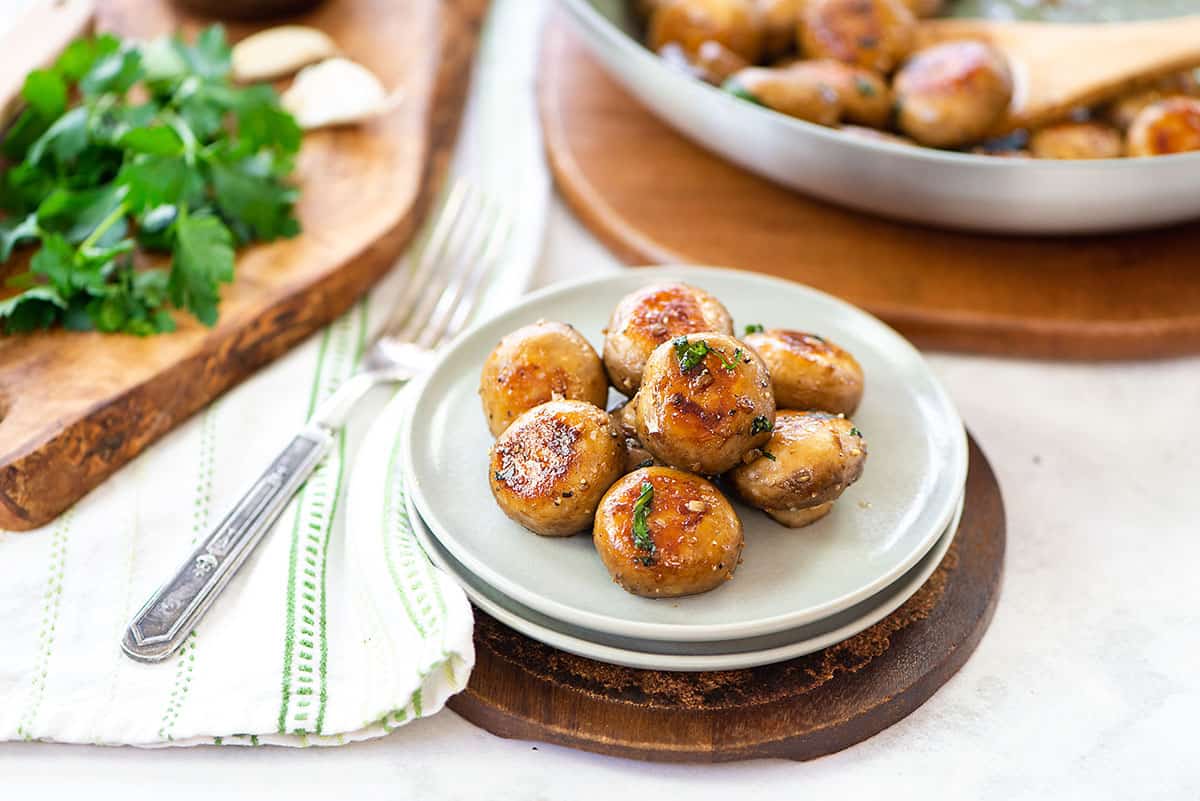 cooked mushrooms on white plate.