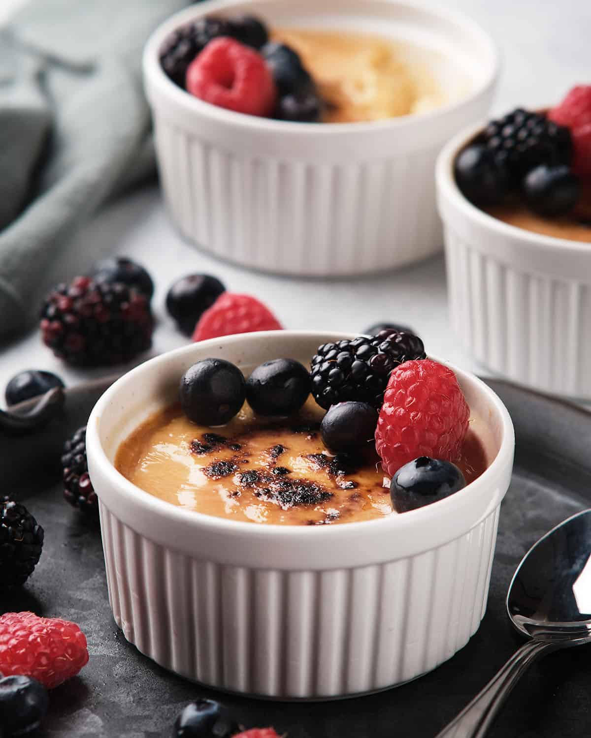 keto creme brulee topped with berries.
