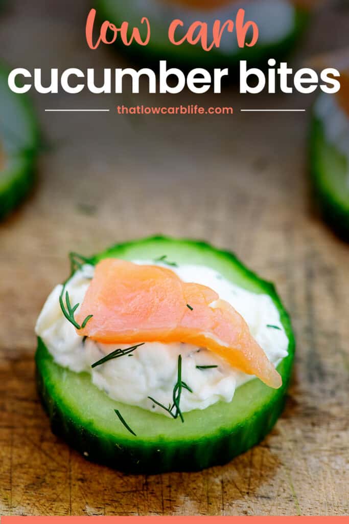 slice of cucumber topped with cream cheese and smoked salmon.