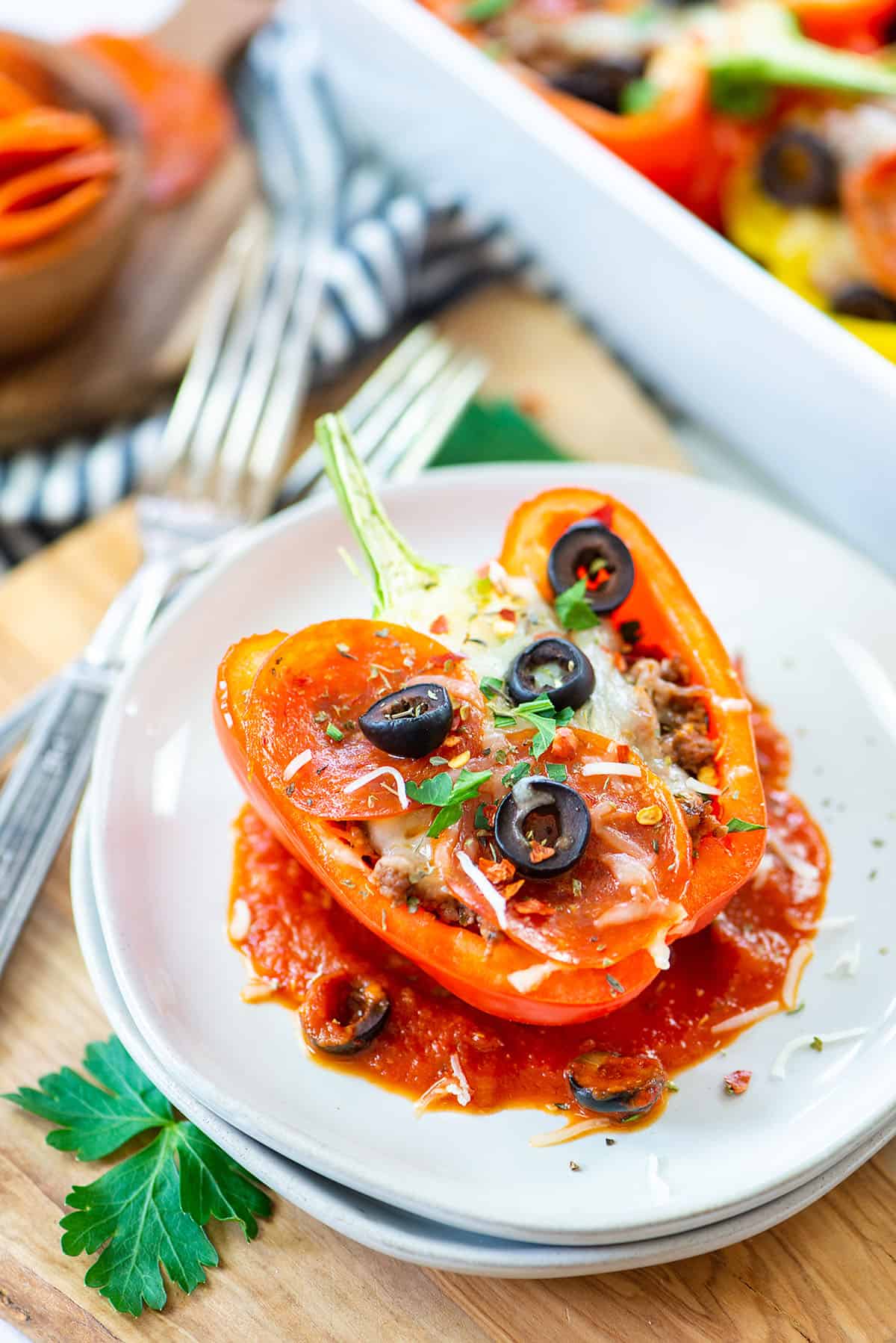 pizza stuffed pepper on white plate.