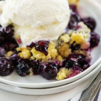 low carb blueberry cobbler on small white plate.