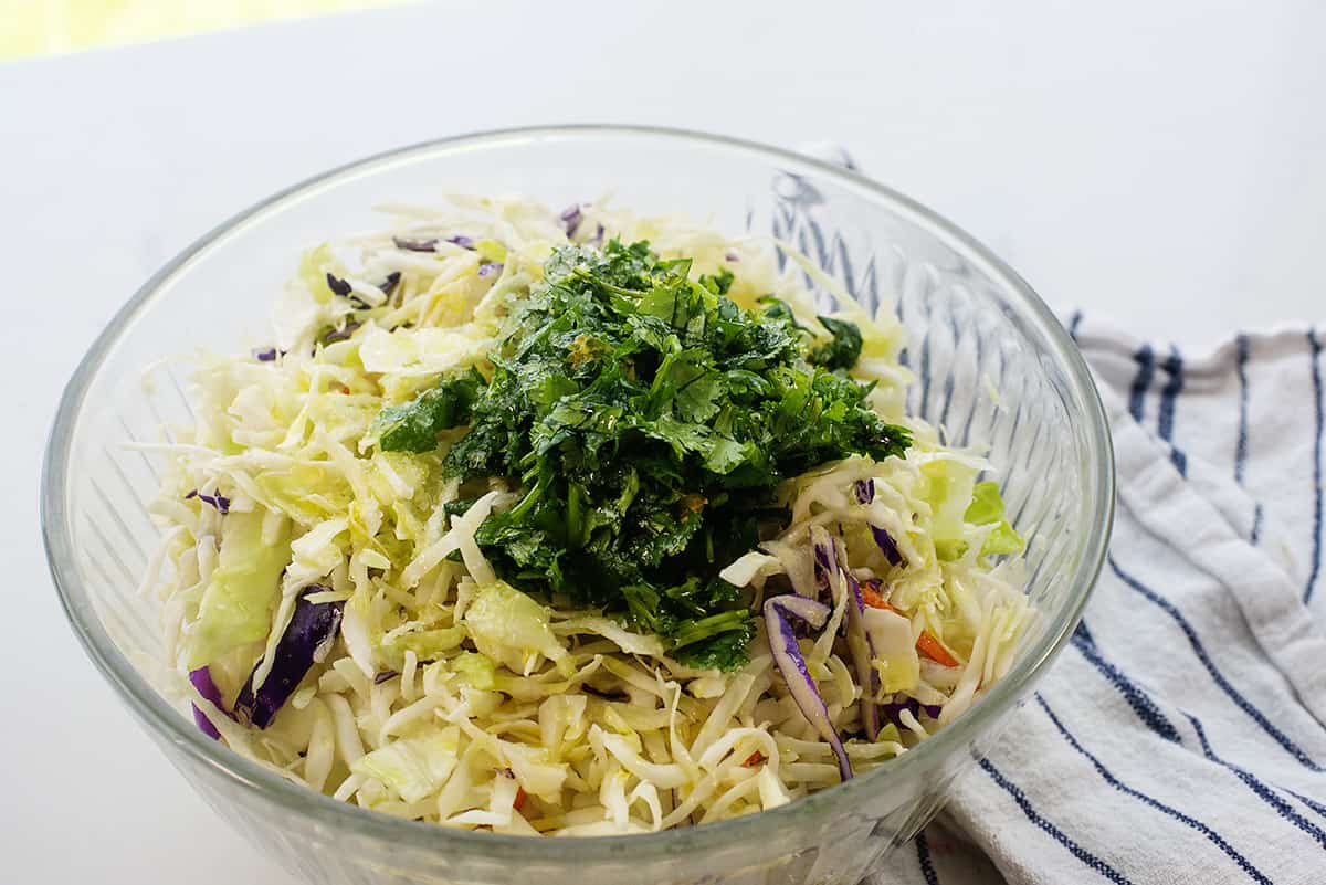 fish taco slaw in glass mixing bowl.