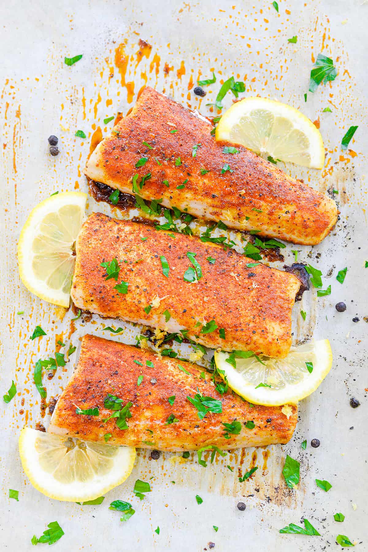 baked lemon pepper fish on sheet pan.