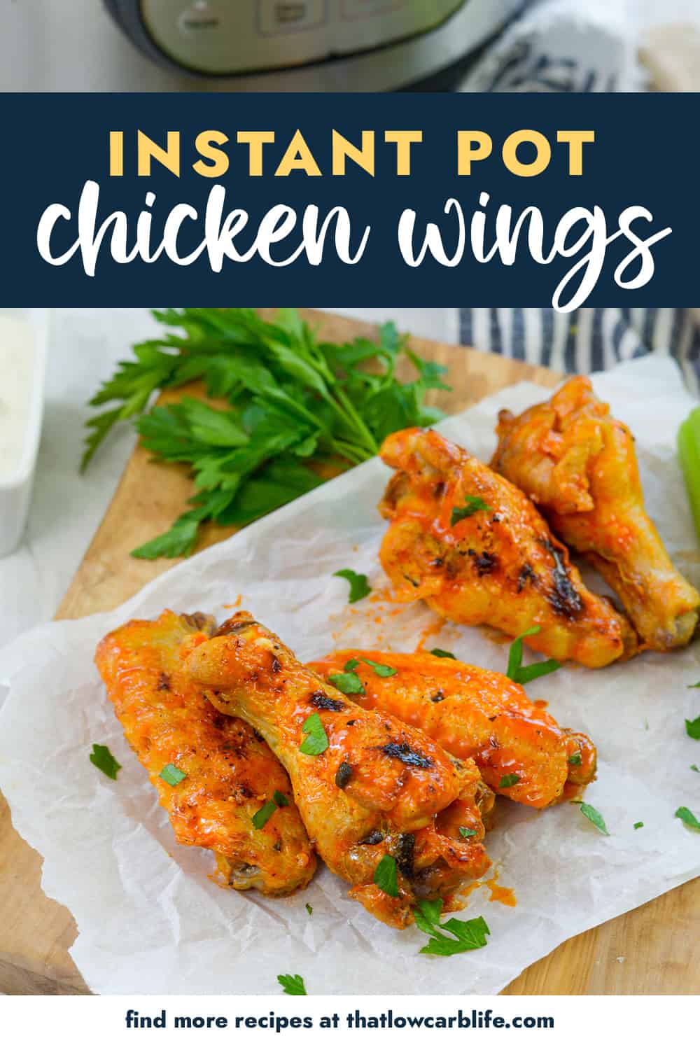 Chicken wings on parchment paper next to Instant Pot.