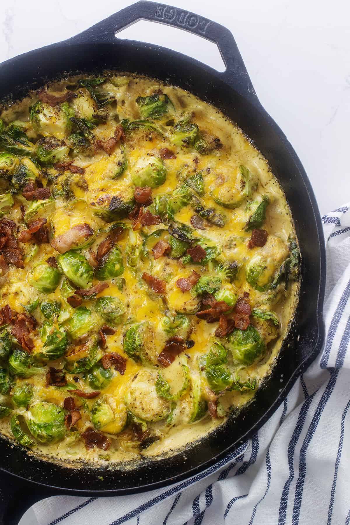 Brussel sprout casserole in cast iron skillet.