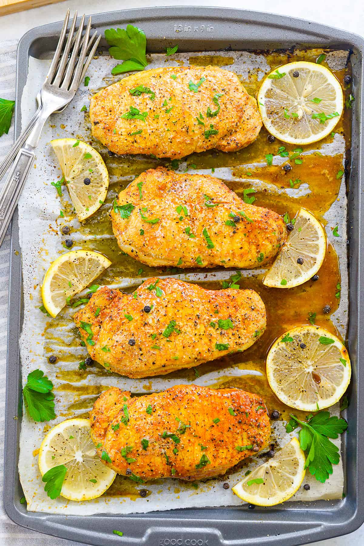 Lemon pepper pork chops on sheet pan.