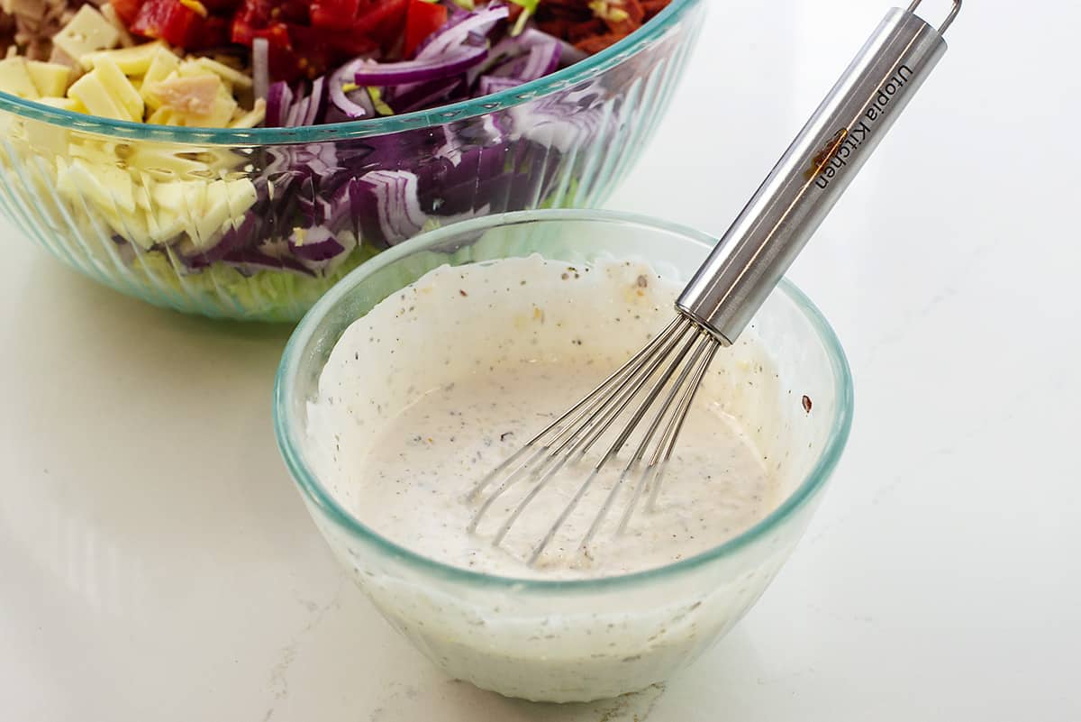 salad dressing in small glass bowl.