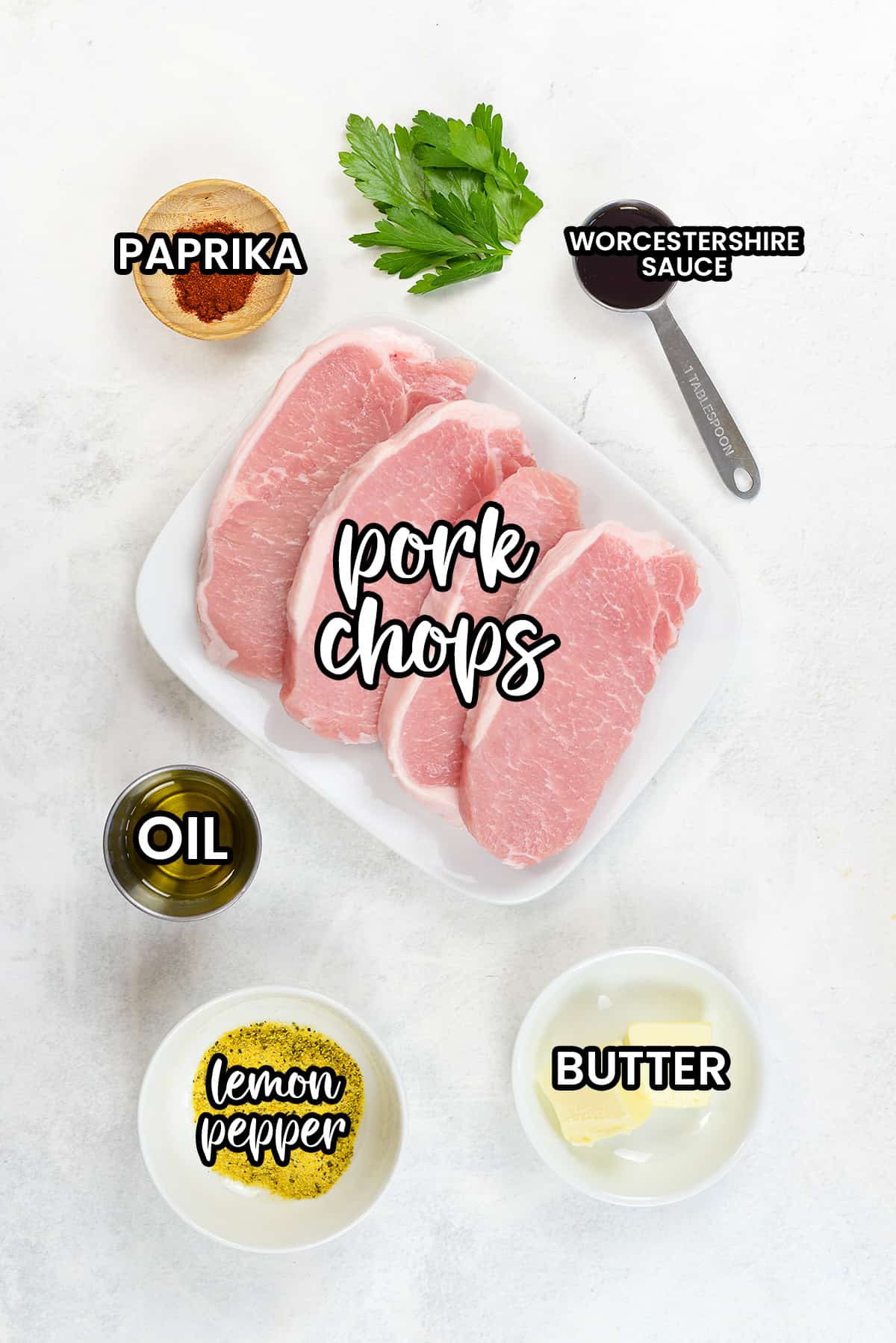 Ingredients for lemon pepper pork chops on counter top.