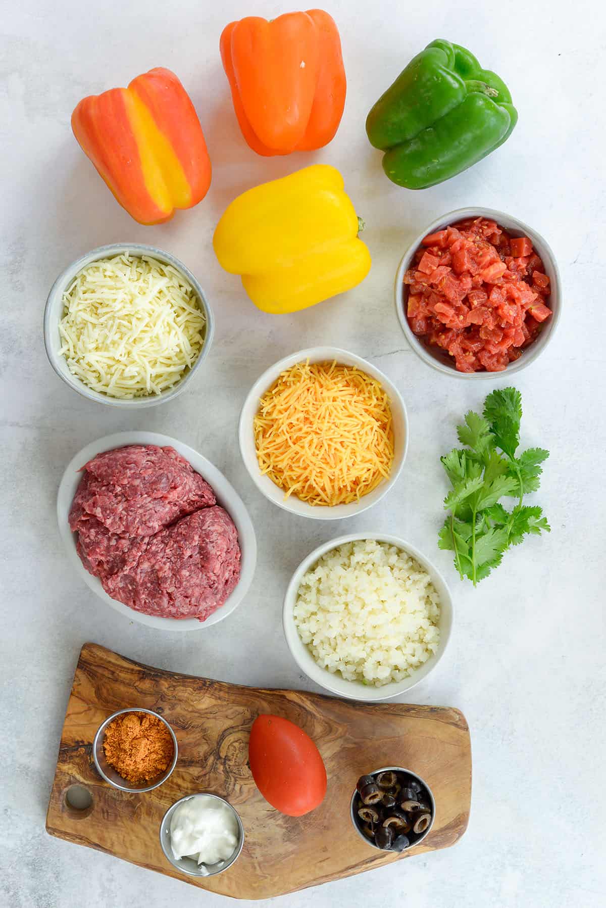 ingredients for taco stuffed peppers on white countertop.