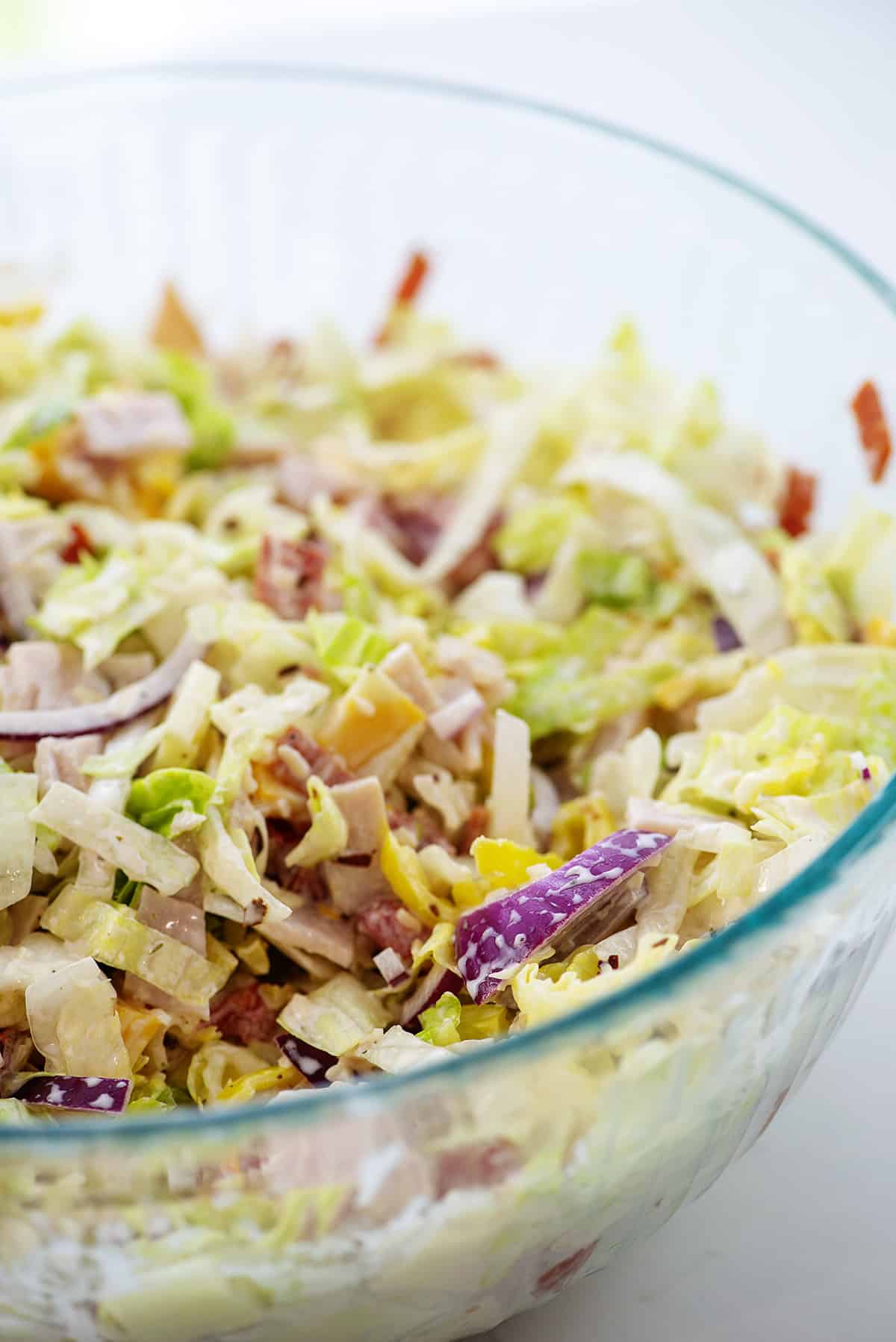 grinder salad in glass mixing bowl.