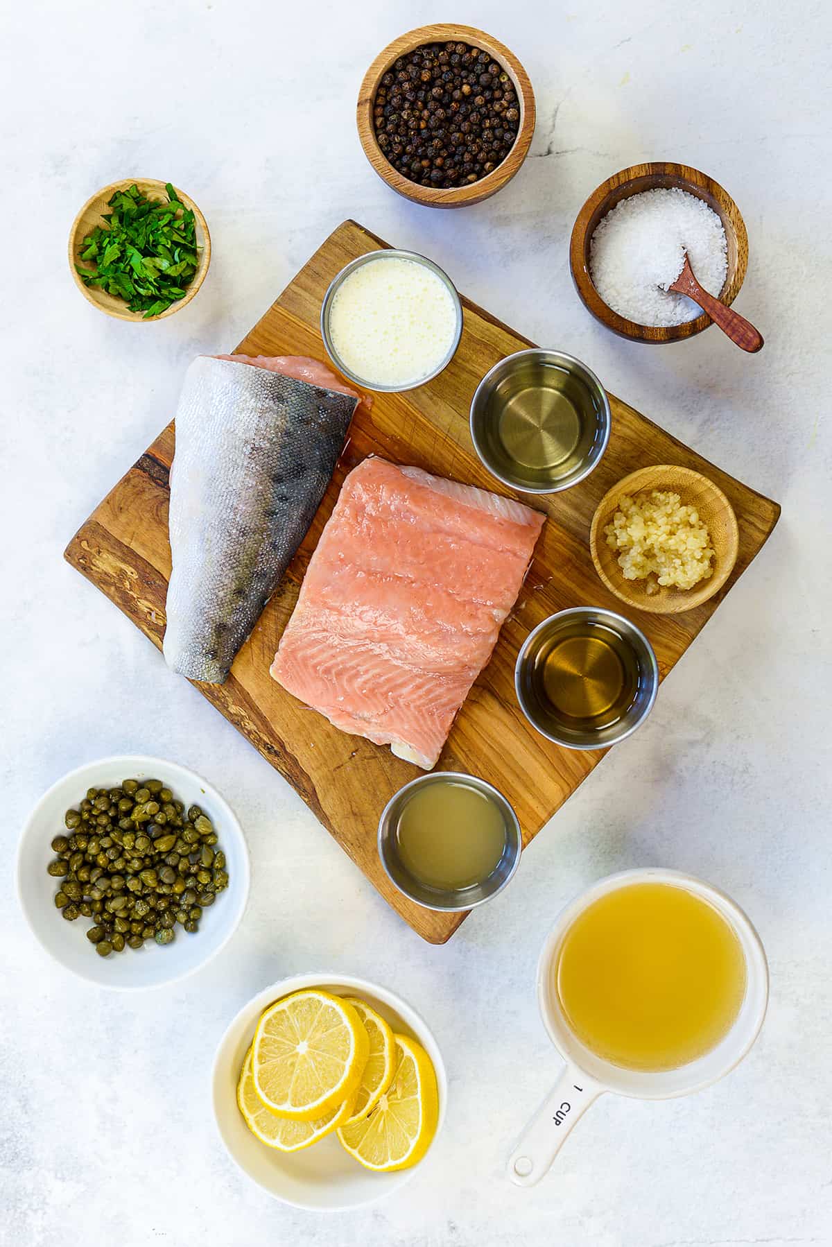 Ingredients for salmon picatta on countertop.