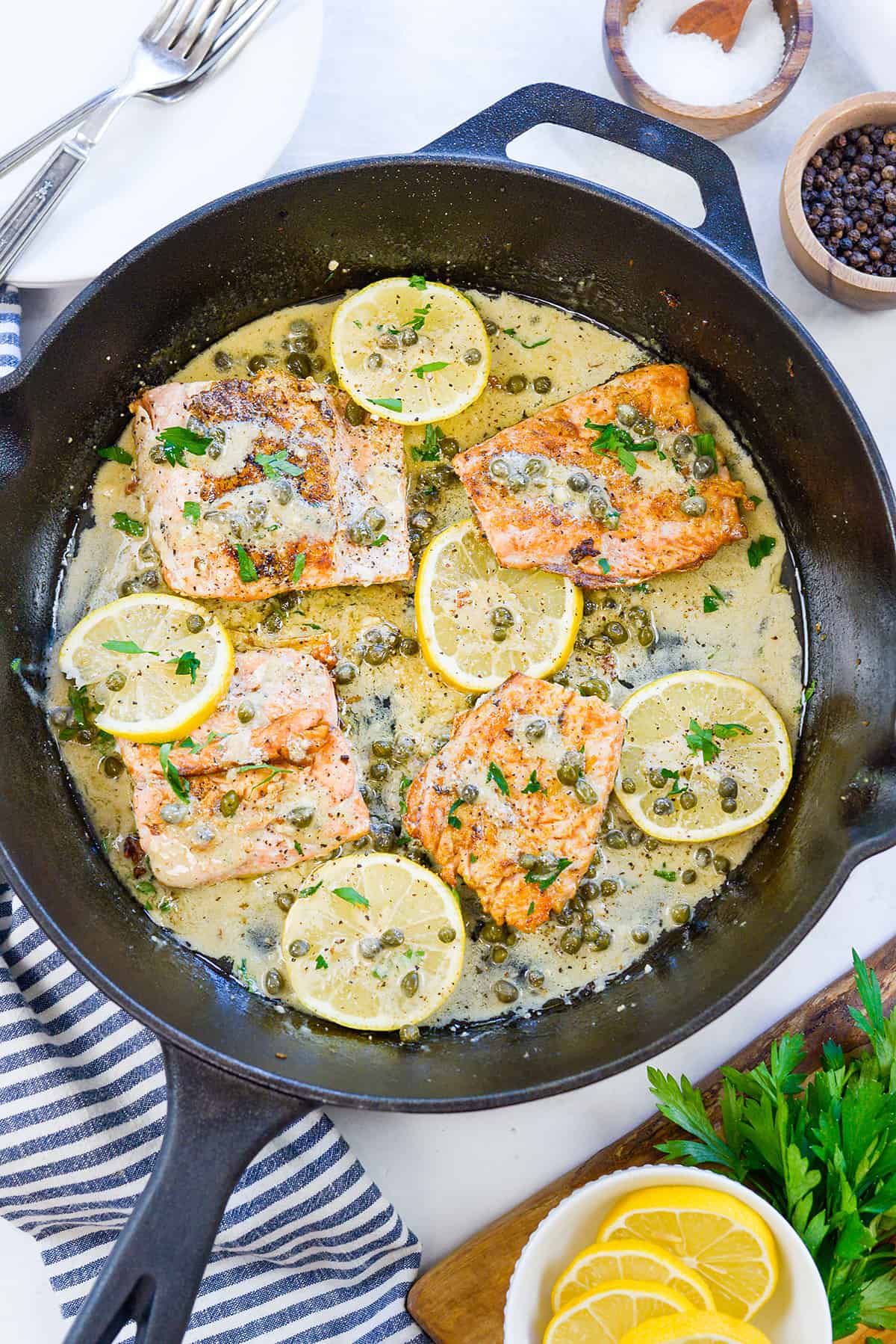 Salmon picatta in cast iron skillet.