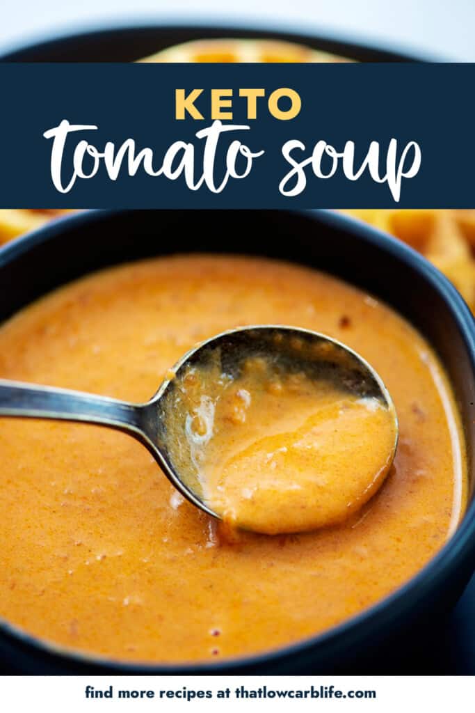 Tomato soup on spoon.