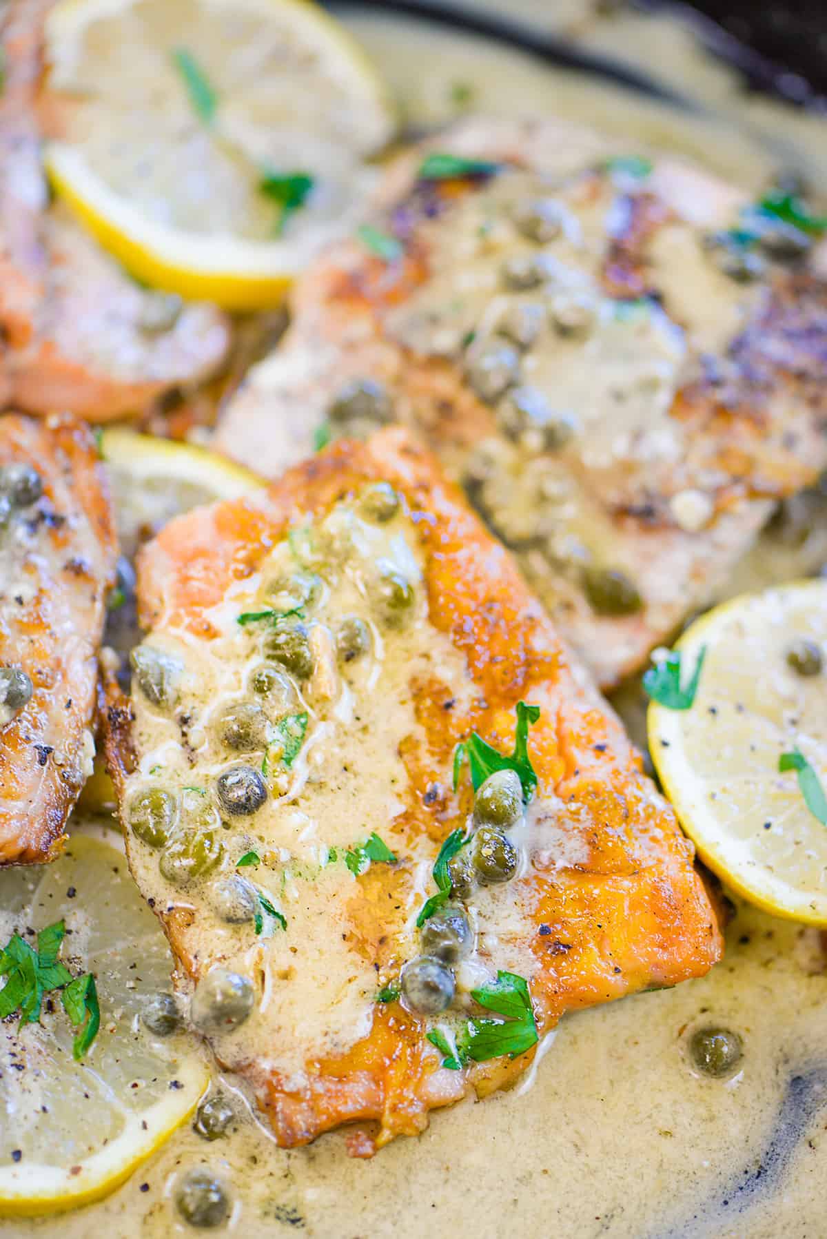 Salmon picatta in skillet.