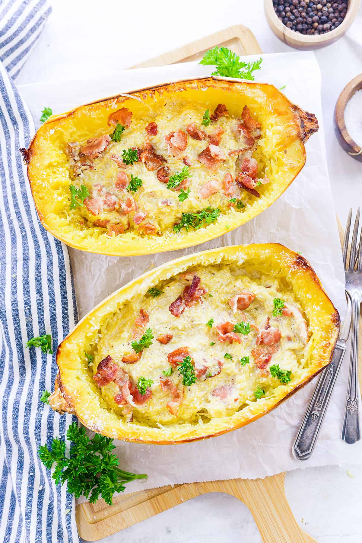 Overhead view of spaghetti squash carbonara in squash shells.