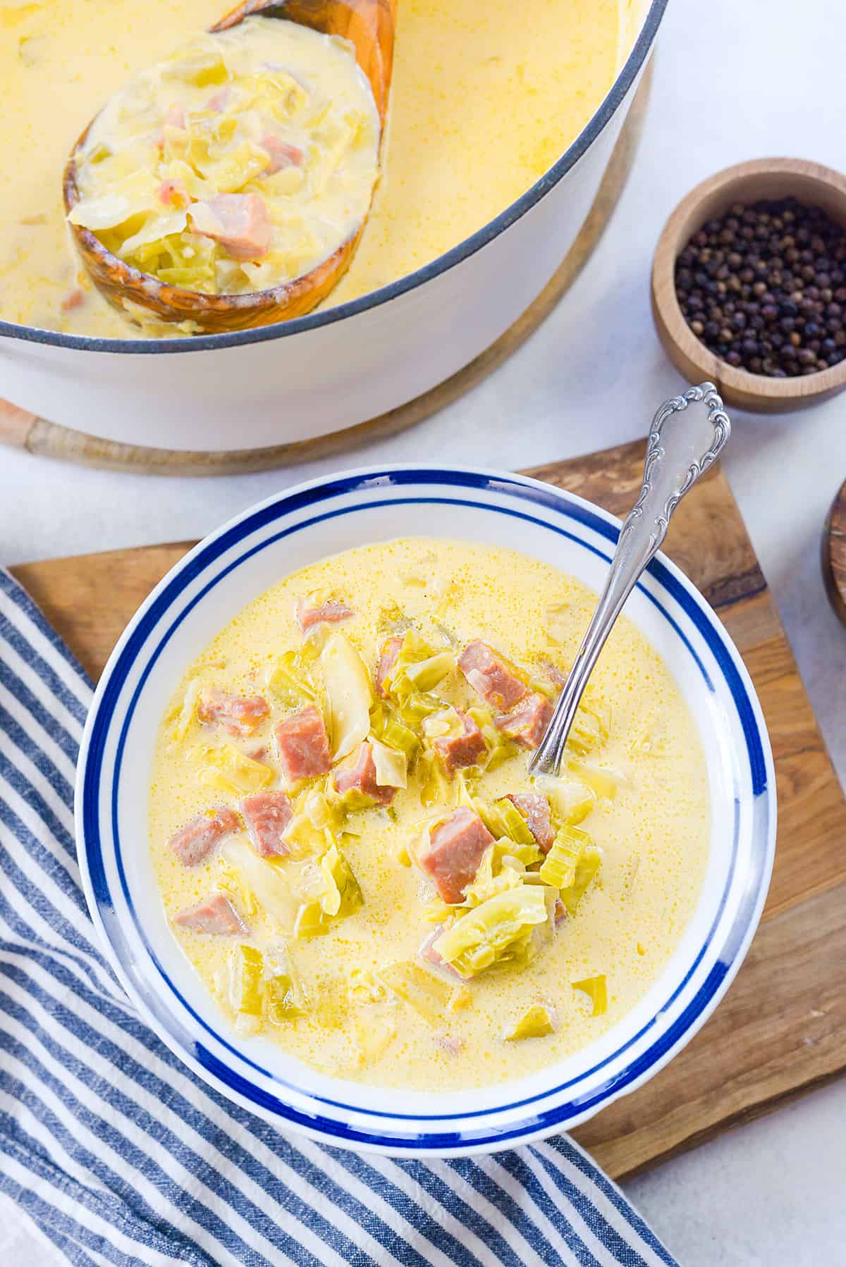 Overhead view of bowl full of ham and cabbage soup.