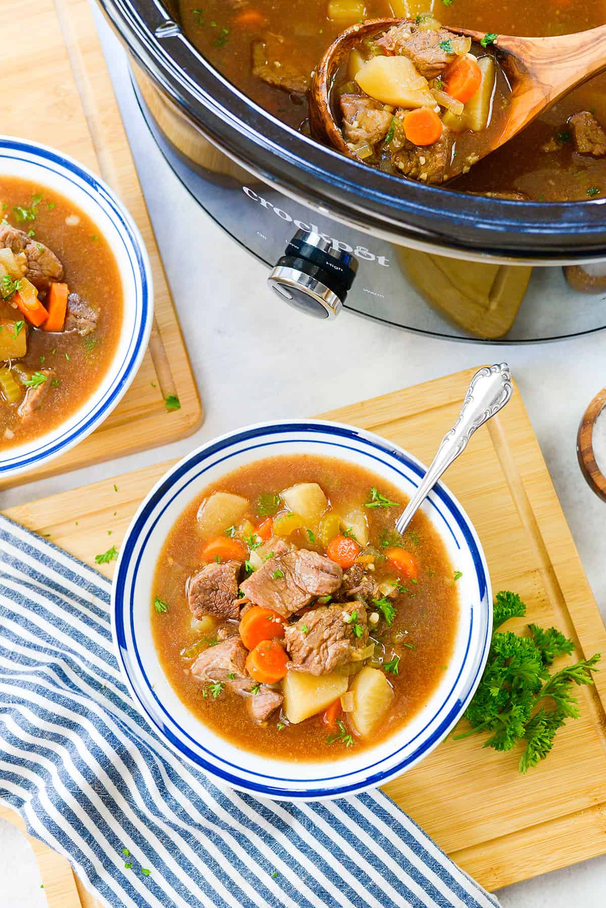 Overhead view of keto crockpot beef stew recipe in white bowl.