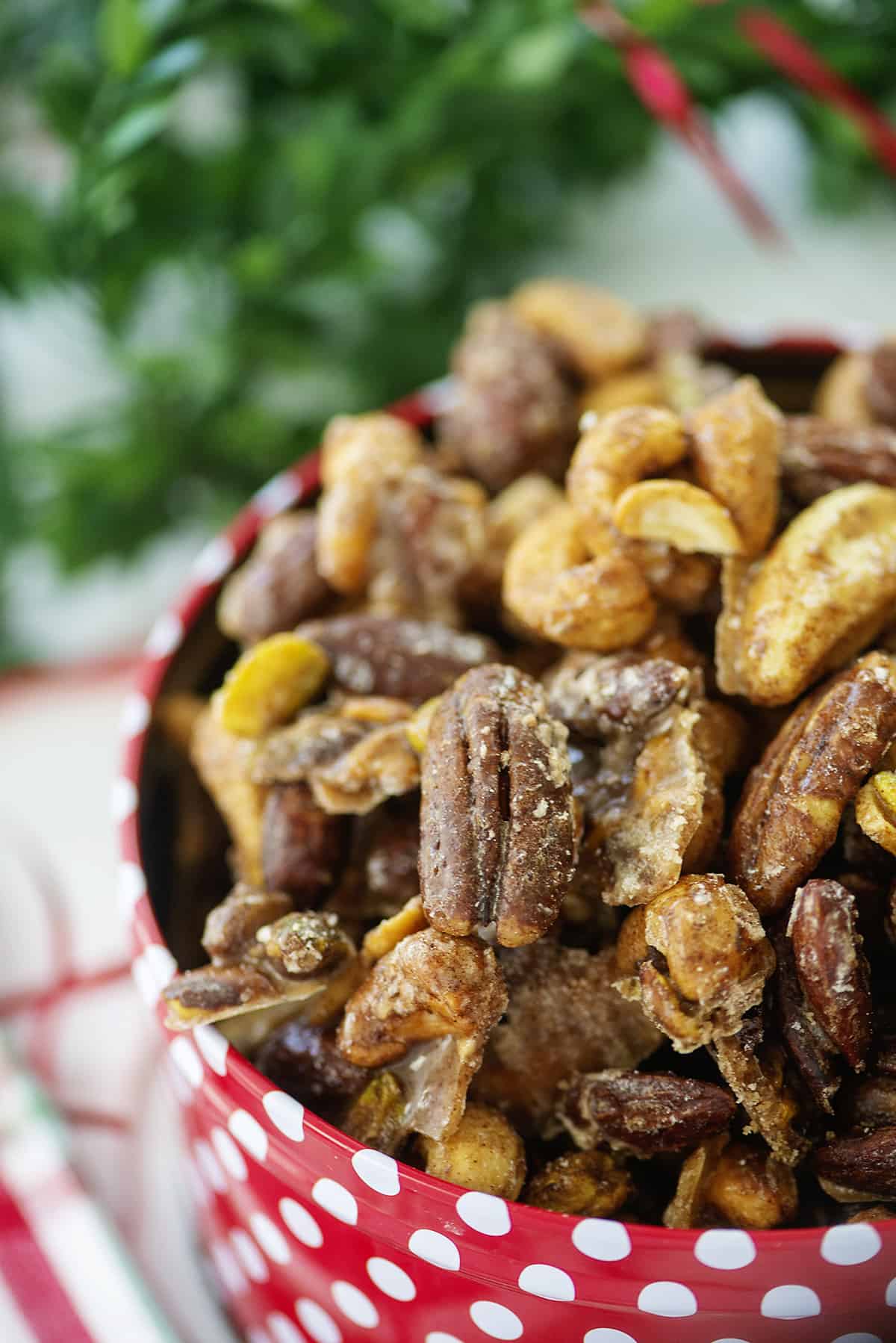 Keto candied nuts in Christmas tin.