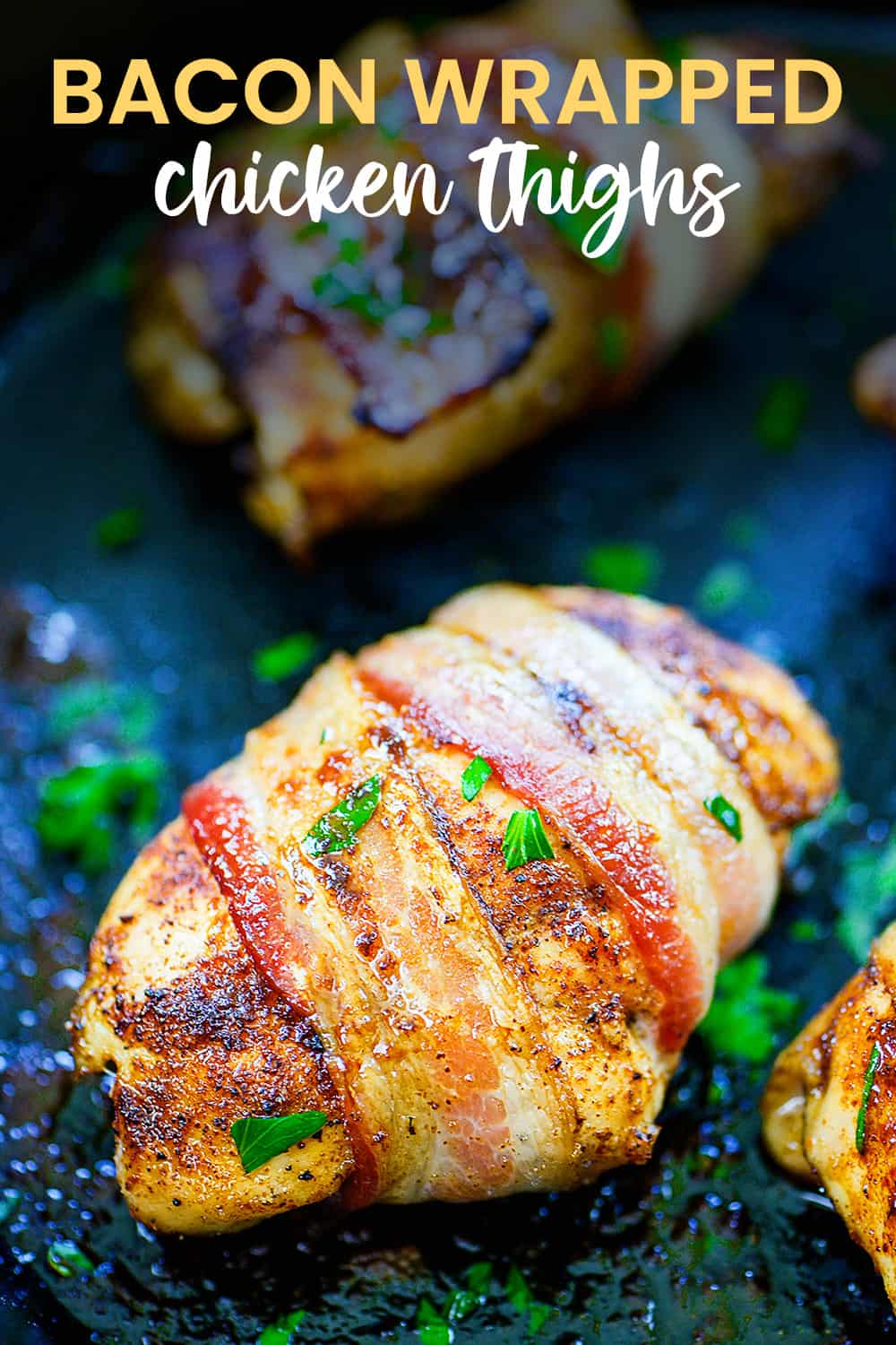 Bacon wrapped chicken thigh in cast iron skillet.