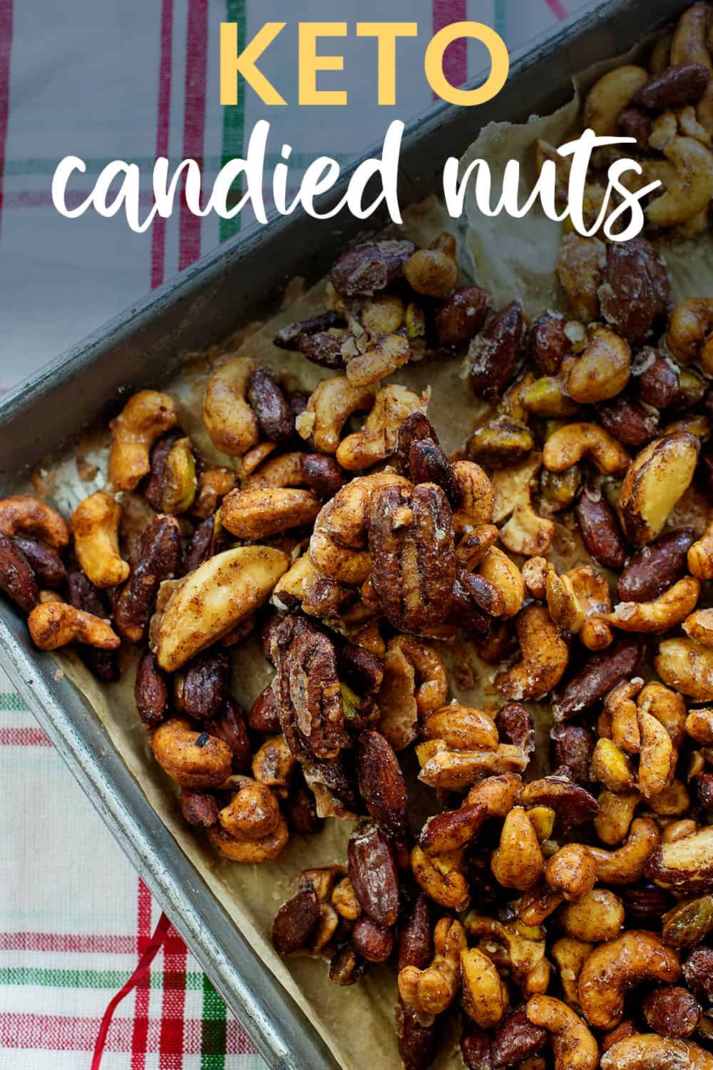 Low carb candied nuts on baking sheet with text for Pinterest.