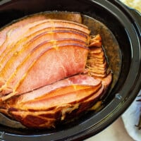 Spiral sliced glazed ham in crockpot.