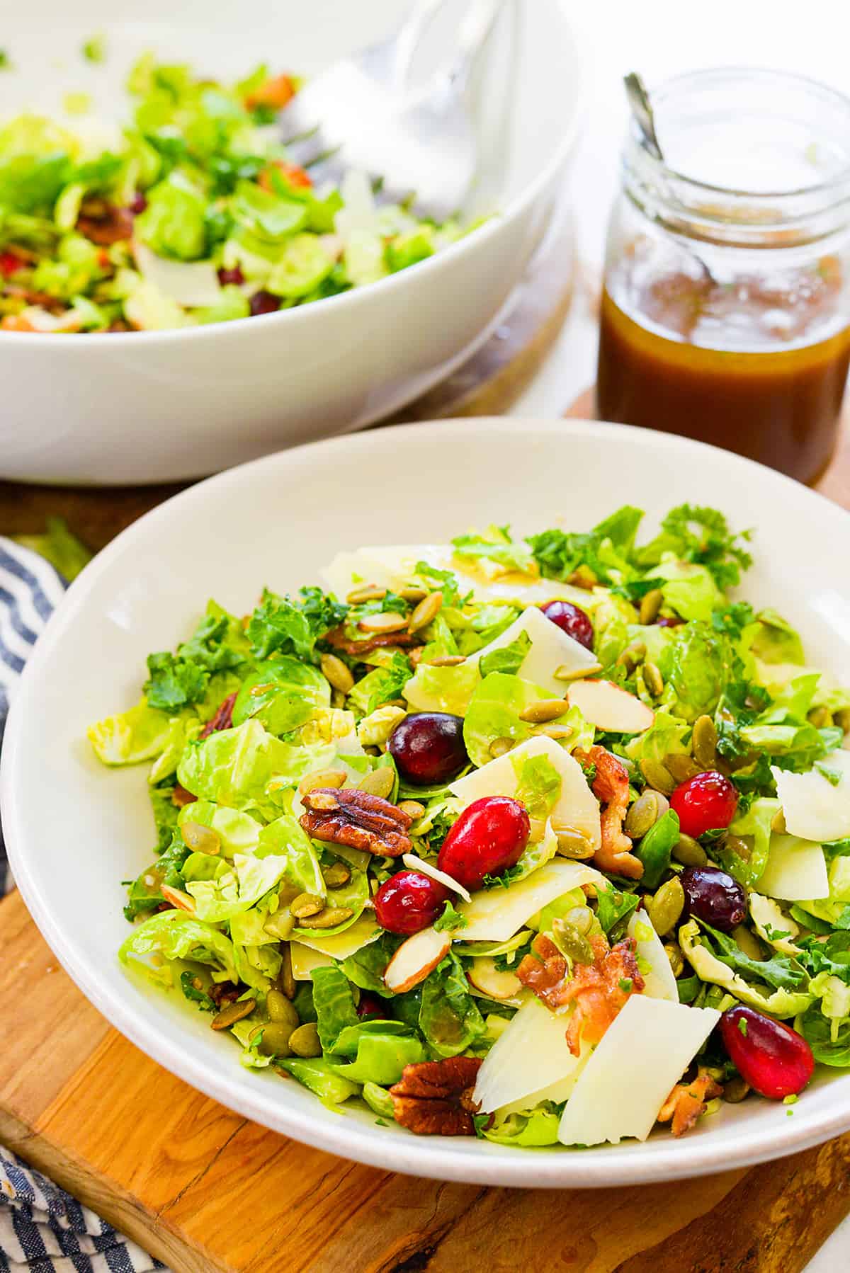Brussels sprouts salad in white bowl.