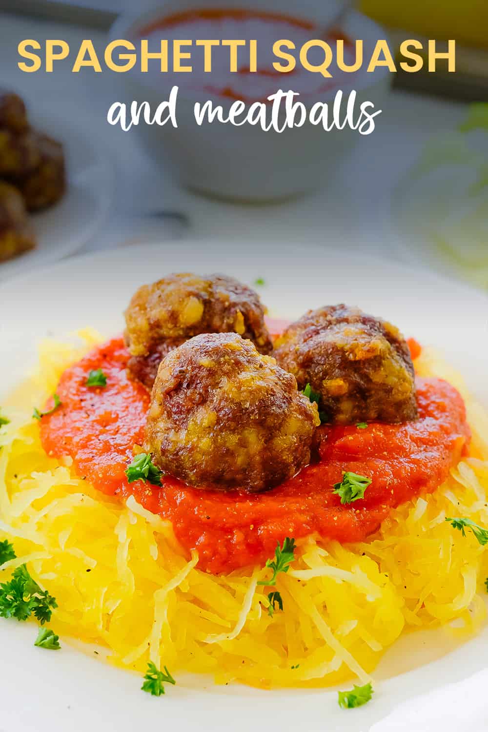 Plate topped with spaghetti squash and meatballs.