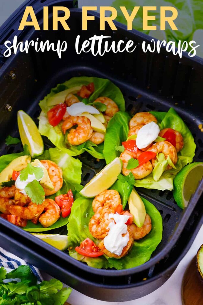 Shrimp lettuce wraps in air fryer basket.