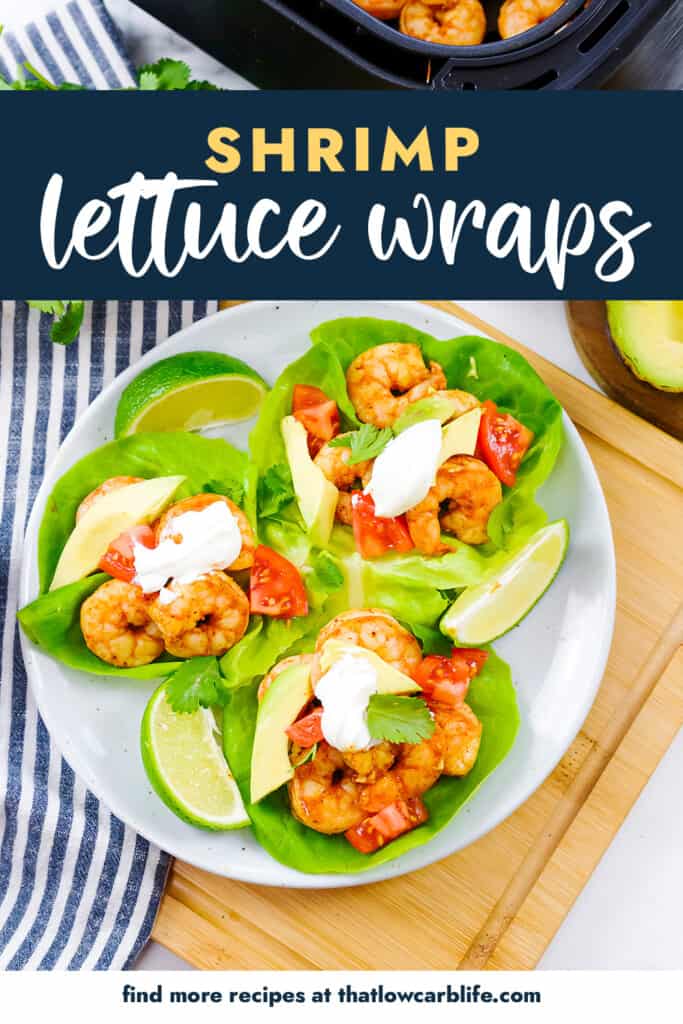 Lettuce wraps filled with shrimp on white plate.