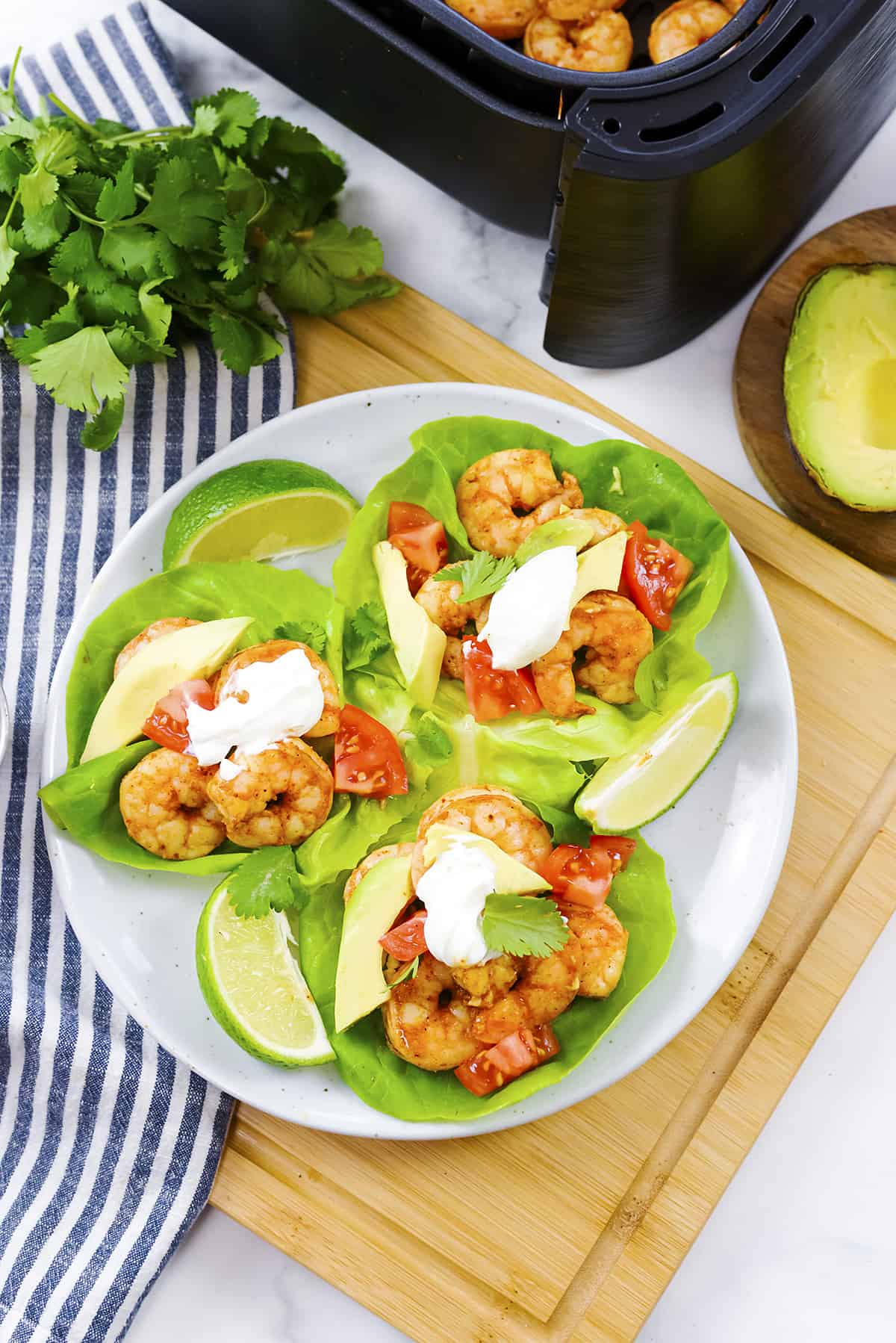 Overhead view of plate full of shrimp lettuce wraps.